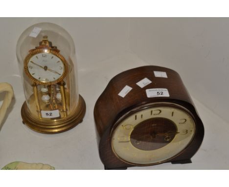 A 1930s oak mantel clock; a gilt metal anniversary clock (2)