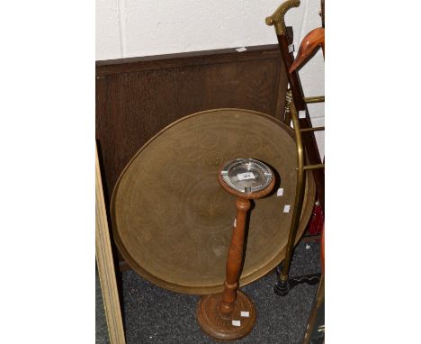 A Persian brass circular tray; an oak smokers stand; a firescreen 