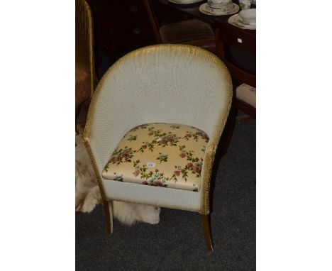 A Lloyd Loom commode chair