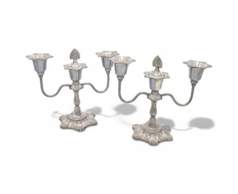 Pair of late 20th century silver three branch candelabra, each with three sconces and twin scrolling branches, raised on a lo