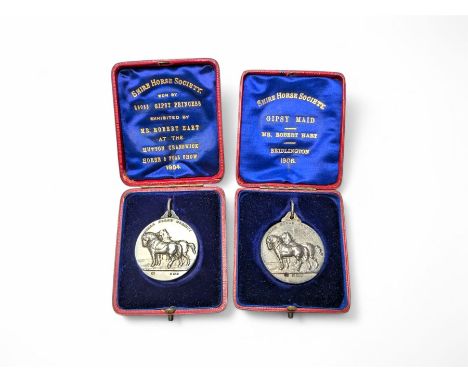 Two Edwardian silver medals, presented by the Shire Horse Society, both decorated in relief with a pair of Shire horses and w