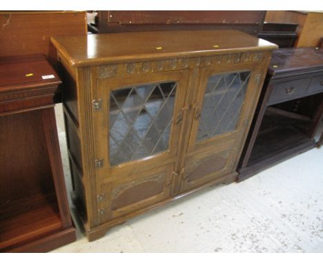 Mid 20th Century oak astragal glazed cabinet on bracket feet.