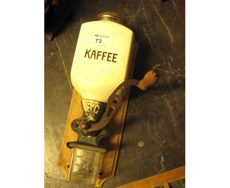 German ceramic wall mounted coffee grinder.