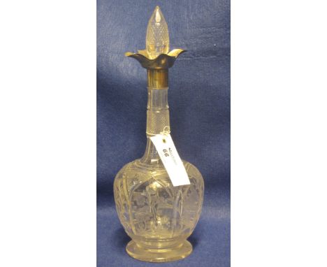Wheel engraved and cut lead crystal mallet shaped decanter with pineapple finial and silver petal mount.
