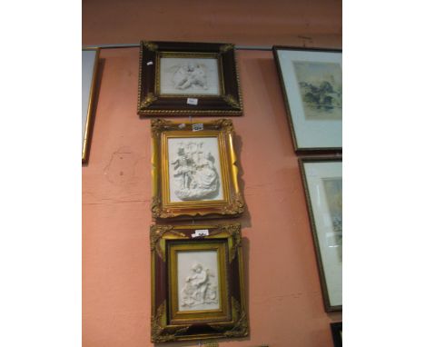 Three similar relief portrait studies, cherubs and a couple in 18th Century dress, framed (modern). (3)