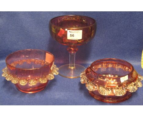 Three items of cranberry glass to include two petalled bowls and a pedestal bonbon dish.  (3)