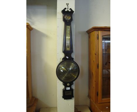 Reproduction mahogany wheel barometer with brass face.

