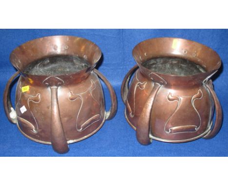 Pair of early 20th Century Art Nouveau design baluster shaped hopper jardiniers or vases with repousse decoration and buttres