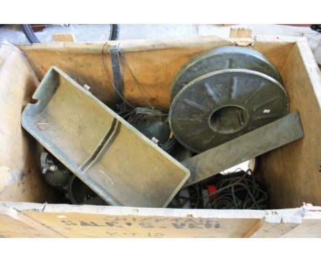 Wooden crate containing military items including kit bags, spot light, fire extinguishers, lamp lenses, storage boxes, cable 