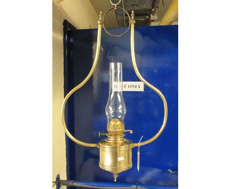 Gilt metal hanging duplex oil lamp.