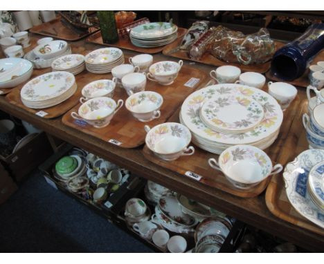 Three trays of Shelley fine bone china part tea and dinnerware items overall decorated on a white ground with floral and foli