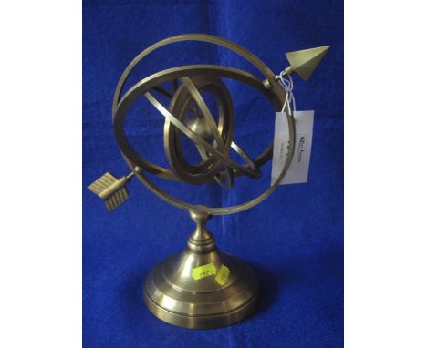 Small modern brass Orrery with arrow motif on circular pedestal base.