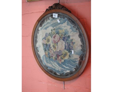Circular wool work tapestry panel, foliate design, in mahogany frame with carved cresting.
