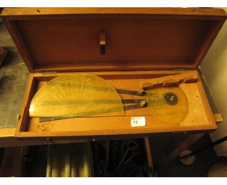 Wooden case of drawing instruments including 360 degree protractor and 180 degree protractor.