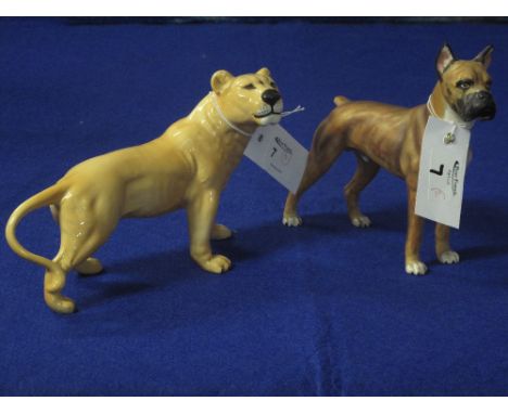 Goebel German porcelain standing boxer dog, together with a Beswick china lioness.  Both with printed marks (2).