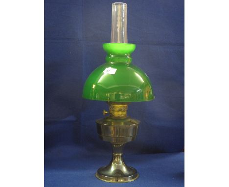 Plated pedestal oil lamp with coloured over-lay glass shade and clear chimney.