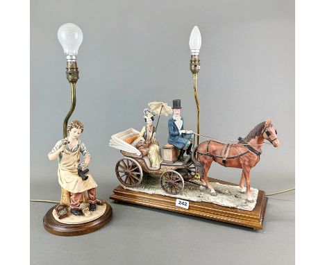 A large resin carriage and horse table lamp on a wooden base together with a further figural table lamp, H. 53cm.