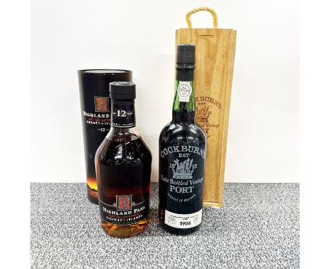 A boxed Highland Park 70cl whiskey together with a 1986 Cockburn's vintage port.