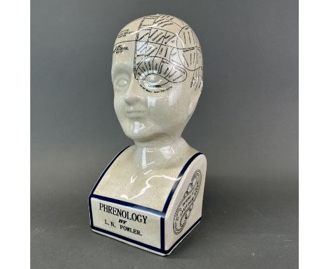 A ceramic phrenology head, H. 39cm.