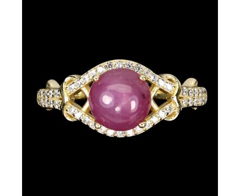 A matching gold on 925 silver ring set with a cabochon cut ruby and white stones, (P).