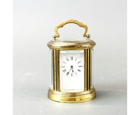 A small gilt brass carriage clock, H. 11cm. Appears to be in working order but not tested.