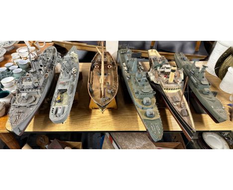 A group of six hand made wooden model ships, largest 103cm.