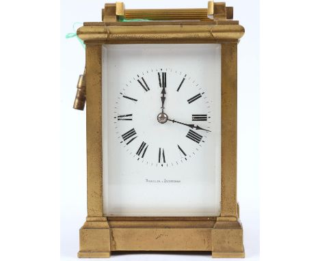 A brass carriage clock, early 20th century, with a platform lever escapement and striking on a coil, the case canted and the 