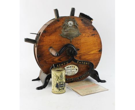 An early 20th century, Kent's rotary knife cleaning machine, with oak body and wrought iron frame with an applied ceramic tra