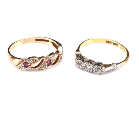 Two rings, including a Ruby and diamond twist ring, size O hallmarked 9 ct with openwork detail and a three stone round cut d