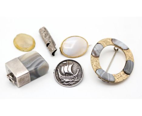 A group of costume jewellery, including a Scottish agate gilt metal brooch, Victorian silver whistle, silver Galleon brooch, 