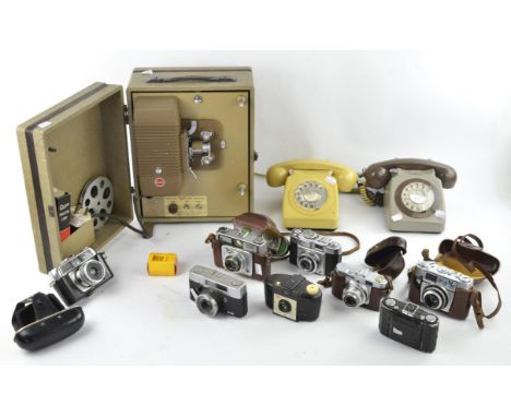A Kodak projector, together with a collection of eight cameras, various makes including Mamiya, Voighlander, Ilford Sportsman
