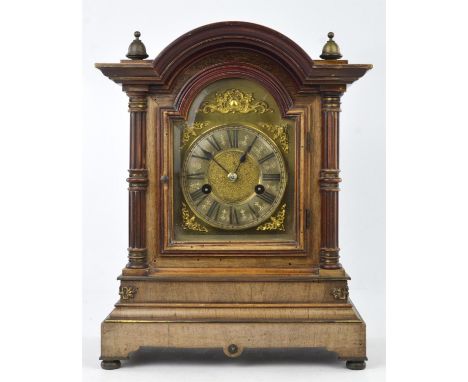 A mahogany cased mantle clock, the two train movement striking on a coiled gong, and a walnut cased wall clock with white ena