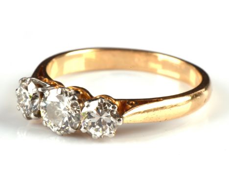 Diamond trilogy ring, set with three round transitional cut diamonds, with an estimated total diamond weight 1.10 carats, siz