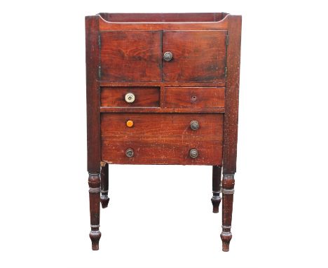 A George III mahogany bedside commode, early 19th century, with brass carrying handles, lower deep drawer adapted, H 86cm, W 