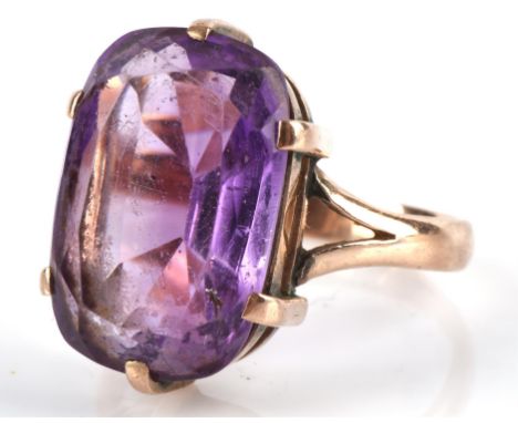 Amethyst cocktail ring, set with an oval cut amethyst, estimated weight 7.30 carats, tested as 9 ct, ring size PCondition Rep