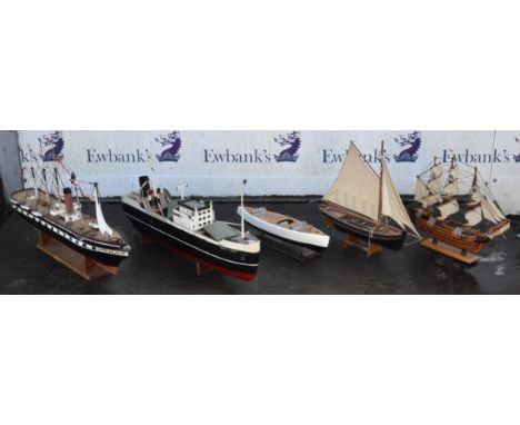 Eight scratch built scale model ships and boats.  The largest 90cm long.  (8)