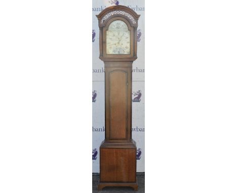 A Victorian longcase clock by Russell and Fouftou, Hull, the hood with pierced arched top, with glazed arched door flanked by