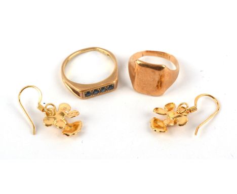 A signet ring, size H, a four stone sapphire ring, size L and a pair of drop earrings, stamped or tested as 18 ctCondition Re