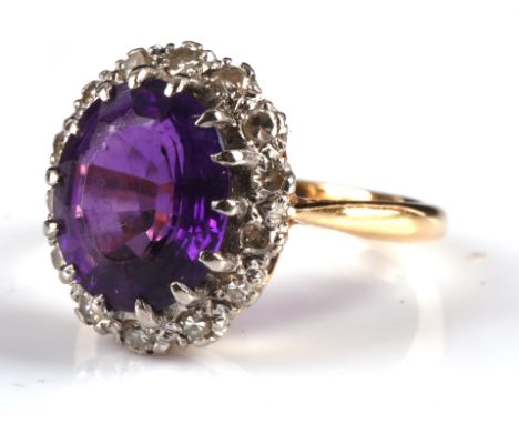 Amethyst and single cut diamond ring, set with an oval cut amethyst and a diamond border total estimated diamond weight 0.14 