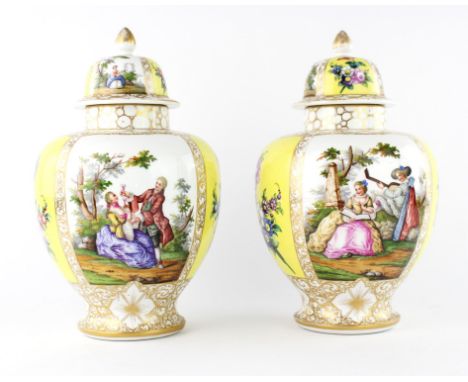 A pair of Augustus Rex porcelain vases and covers decorated with figures against a yellow and gilt ground.  (2)Condition Repo