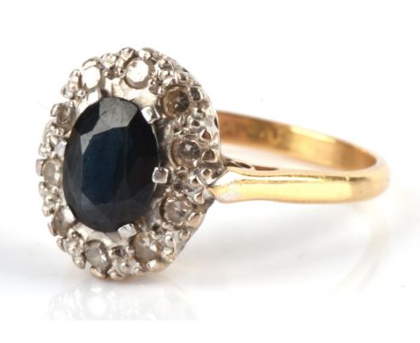 Sapphire and diamond cluster ring, set with oval cut sapphire, estimated weight 1.48 carats and total estimated diamond weigh