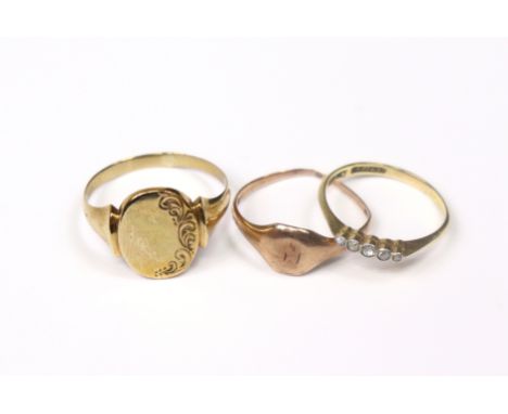 An 18ct. gold ring set row of five tiny diamonds, size: O, 1.6gm; &amp; two 9ct. gold signet rings, 5.9gm combined.