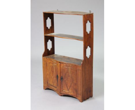 An early 19th century French fruitwood three-tier wall shelf with pierced &amp; shaped sides, the bottom tier enclosed by pai