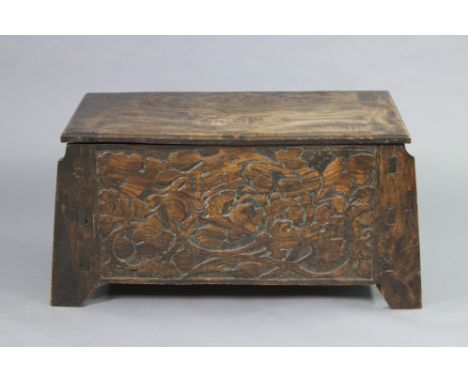 A late 19th/early 20th century Chinese carved elm trunk with all-over foliate decoration, of rectangular form with tapered si