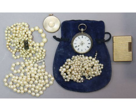 A Dupont gold-plated pocket cigarette lighter; a flat circular gilt-metal pendant locket; a continental silver pocket watch (