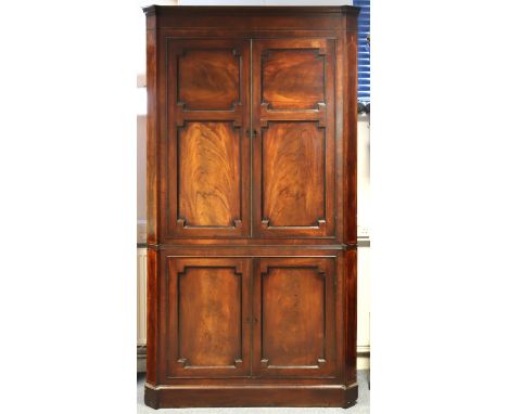 An 18th century inlaid mahogany corner wardrobe (converted from a corner cupboard) fitted with a single shelf above a hanging
