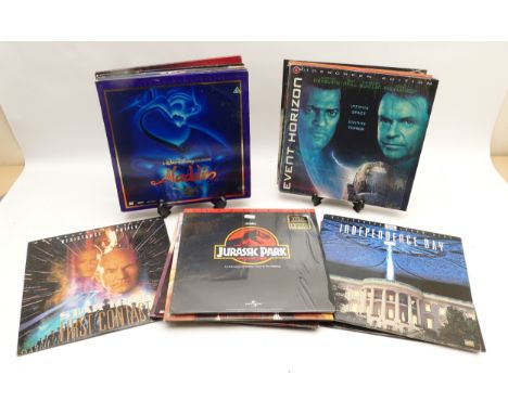 A collection of laser disc films and vinyl to include, Capricorn One, Independence Day, Twister, Jurassic Park, Die Hard With