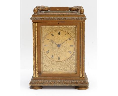 An early twentieth century brass cased carriage clock, with a chased dial framed by a plain chapter ring featuring Roman Nume