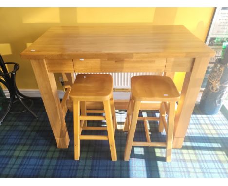 A modern solid light oak "Butchers Block" breakfast bar, comprising blocktop table of rectangular form with a long drawer to 