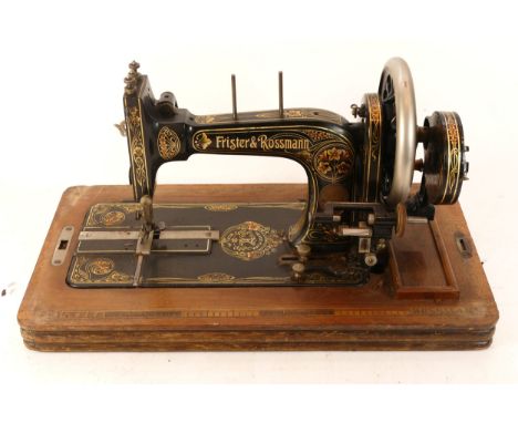 An early 20th century Frister &amp; Rossmann manual sewing machine in mahogany case together with a mid 20th century large tr